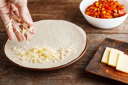 making of tortilla for quesadilla, cooking for healthy fresh quesadilla, tacos, buritto, fajitas. The concept of national cuisine, healthy fast foodの写真素材