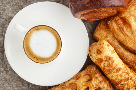 coffee and mouth-watering cakes. Espresso in a white cup on a saの写真素材