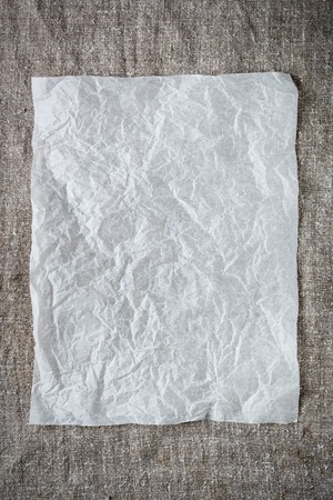 crumpled sheet of paper on a gray background. Place for entries. Layout Designの写真素材