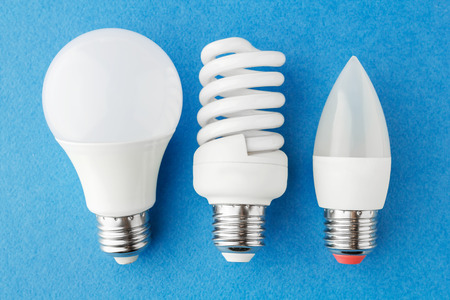 different types of energy-saving lamps on a blue background. Close-up, top viewの写真素材