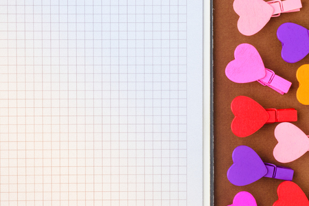 White paper and small colored hearts with copy space. Note to the Valentine's Dayの写真素材