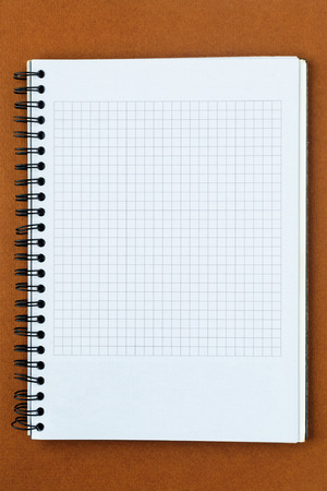 White paper notes on a brown backgroundの写真素材