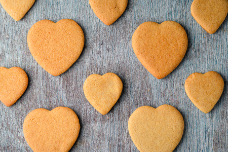 A pattern of ginger biscuits on a gray wooden table. top viewの写真素材