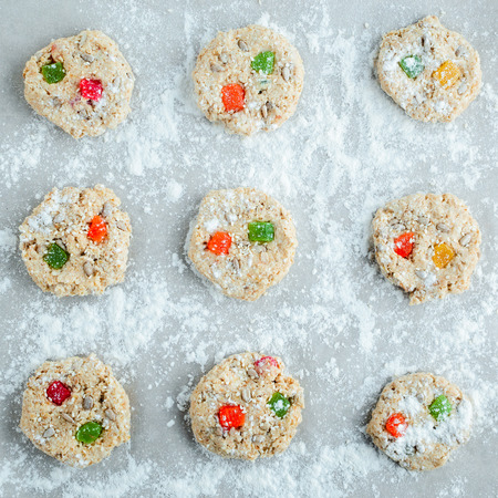 Oatmeal pastry balls are laid out in rows on parchment for baking. Top viewの写真素材