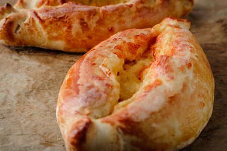 Khachapuri on a wooden table close-up . National Georgian cuisineの写真素材