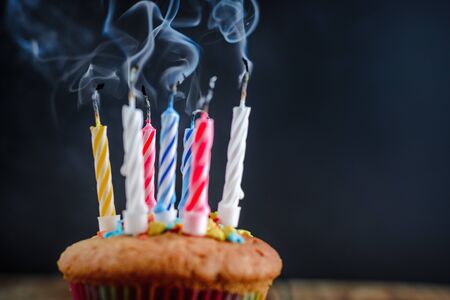 smoke from faded festive candles on a dark backgroundの写真素材