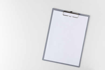 clipboard with a blank sheet of paper on a light background with copy space. Empty template for designerの写真素材