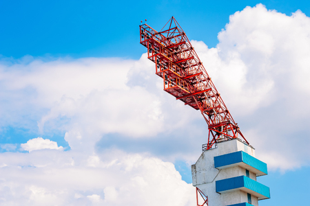 Lighting tower of stadium on blue cloudy sky backgroundの写真素材