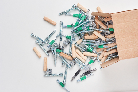 Open box with fall out tools for furniture assembly, closeupの写真素材