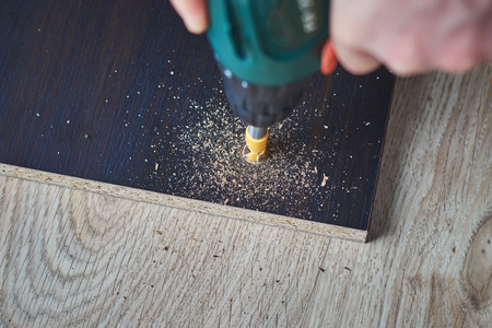 Drill bit drilling boards, wooden processingの写真素材