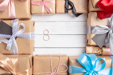 Frame of gift boxes with ribbon and bows on white background, copy spaceの写真素材