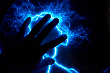 Electric plasma ball on dark background. Static electricity modelの写真素材