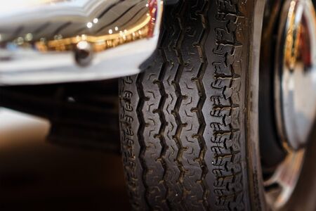 Vintage wheel with protector of retro car, close up