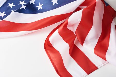 Close up of waving national usa american flag on white background with copy space. Concept of  4th...