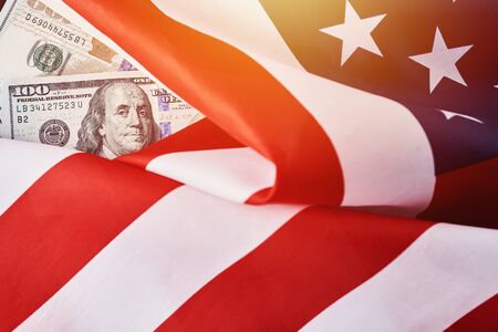 USA national flag and dollar bills. Business and finance concept