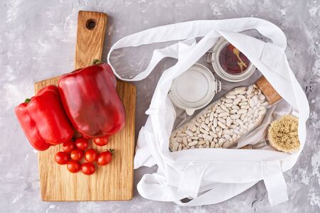 Kitchen utensils background with cutting board and reusable glass  containers with food ingredients. Zero waste conceptの写真素材