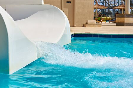white water park slide and swimming pool. Aqua park background