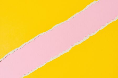 Torn ripped paper edge with copy space, pink and yellow color background