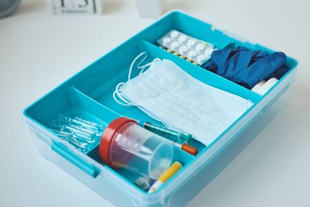 First aid kit  close up. Home medicine box with medical items. Healthcare and medicine concept.の写真素材