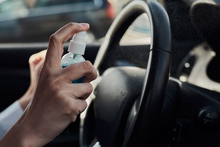Hand disinfect car with sanitizer. Coronavirus covid-19 protection concept