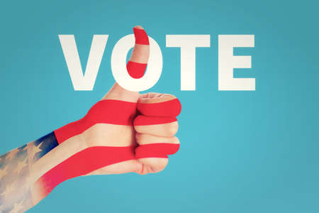 USA president election day concept. Thumb up gesture and inscription vote on blue background