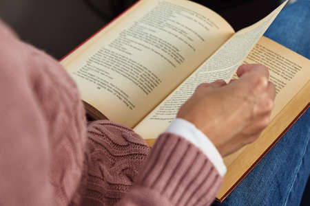 Woman sitting and reading book. Relaxing concept