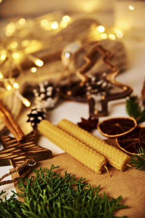 Composition with a christmas decorations, candles and garland lights. Hugge mood backgroundの写真素材
