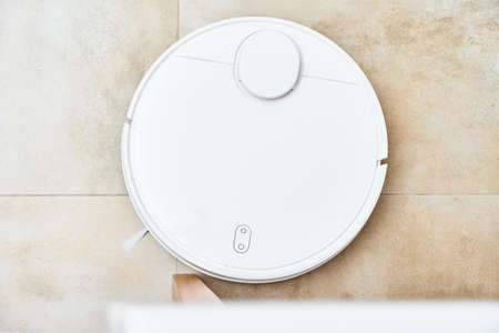Robot vacuum cleaner working on the floor with furniture, obstacles for robotic vacuum cleaner....