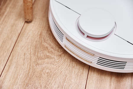 Robot vacuum cleaner working on the floor with furniture, obstacles for robotic vacuum cleaner....