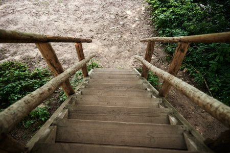 Old wooden steps. Wooden stairs for descent down and rise up