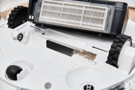 Repair robot vacuum cleaner, close up. Household appliance serviceの写真素材