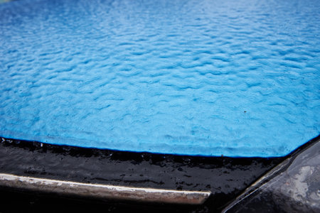 Car covered in freezing rain. Extreme winter weather for a drivingの写真素材