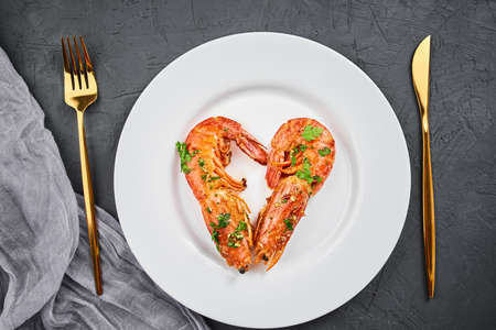 Two shrimps in shape of heart on plate, top view. Love conceptの写真素材