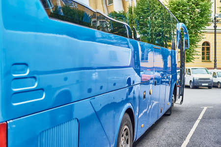 Blue tourist bus in the city street. Tourism and travel conceptの写真素材