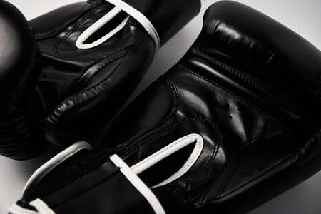 Pair of black boxing gloves on white background, close upの写真素材