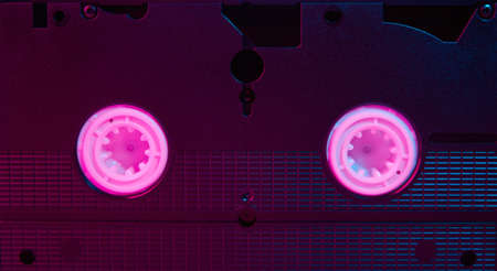 Video cassete on color background. Retro vhs cassette tape, close up