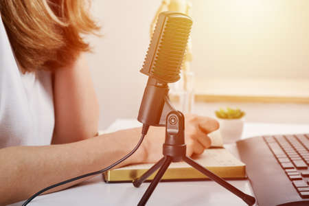 Woman in headphones have online lessons at home. E-learning and podcast conceptの写真素材