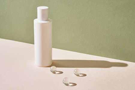 Beaty product package. Cosmetic bottle on pastel green background. Cosmetics mock upの写真素材