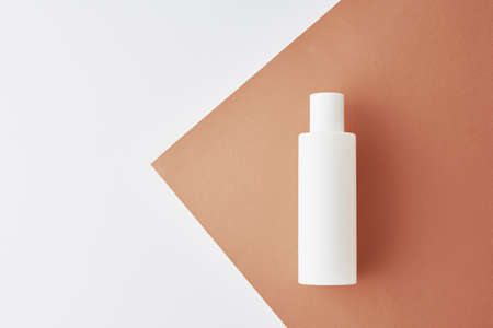 Natural cosmetics mock up. Beauty product concept. White bottle on pastel background