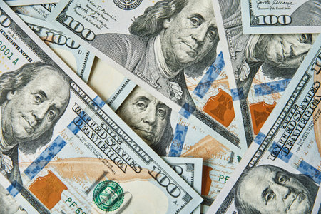 Dollar bills background. Pile of american money cash. One hundred usd dollars banknotes. Financial...