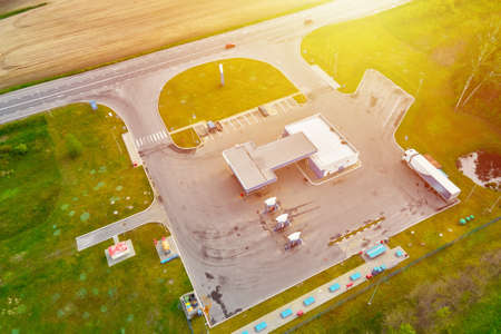 Gas station near highway with moving cars, aerial view.の写真素材
