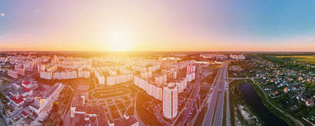 Cityscape of Gomel, Belarus. Aerial view of town architecture, panorama. City streets at sunset,...