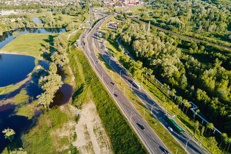 Car moving on the bridge road in the city. Cityscape aerial view. Urban landscape with highway road,...