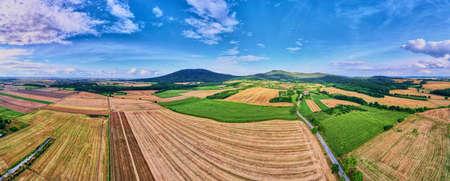 Aerial view of agricultural and green fields in countryside. Nature landscape in summer day, panoramaの写真素材