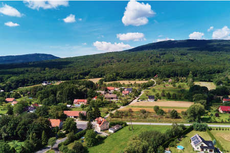 Mountain village with forests, bird eye view. Sleza mountain landscape near Wroclaw in Poland. Nature background, aerial view.の写真素材