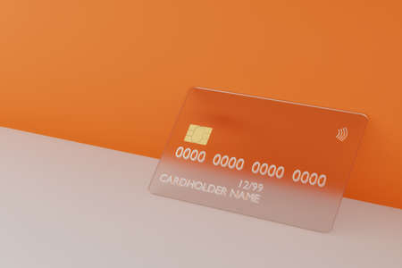 Transparent glass credit card on orange background. Bank card mock up, 3d illustration. Online shopping and digital money concept. Glassmorphism styleの写真素材