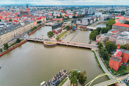 Panorama of Wroclaw city with colorful roofs. Street of Wroclaw, aerial view. Wroclaw, Poland -...