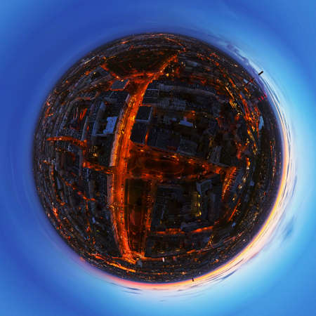 Aerial view of night cityscape. Wroclaw panorama at sunset with glowing streets and dramatic sunset...