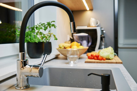 Modern kitchen interior with faucet and sink. Process of cookingの写真素材