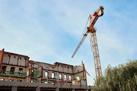 Construction crane constructing a building in the city